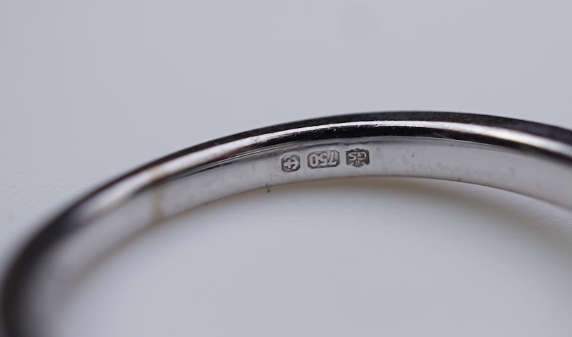 A diamond engagement ring and half eternity ring